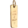 A gold-plated brass pendant with the inscription 'LA VITA E³ BELLA' in a cursive script.