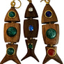 Wooden fish-shaped earrings with gemstone inlays on a display card.