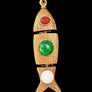 Wooden fish-shaped pendant with colored stones on a textured gray background