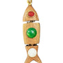 Wooden fish-shaped pendant with colored stones on a textured gray background