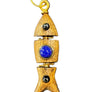 Wooden pendant with blue stone and gold accents on a textured black background