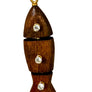 Wooden fish-shaped pendant with three gemstones on a beige background