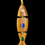 Wooden pendant with embedded gemstones on a textured surface