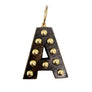 Letter 'A' pendant with gold accents on a light gray background