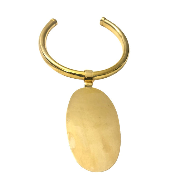 Elevate your style with this gold statement choker necklace featuring a large oval pendant. Bold, elegant, and timeless designer jewelry.